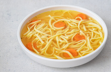 Homemade chicken noodle soup. Selective focus
