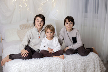 Family portrair of mother with her three children on white
