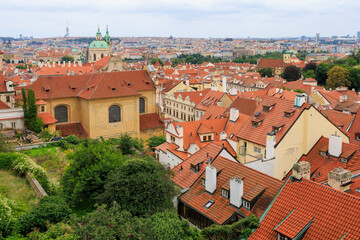 Fototapeta premium Roofs of houses and a view of the city of Prague. Background with selective focus and copy space