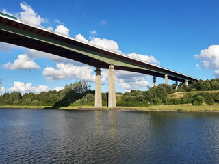 Fototapeta na wymiar bridge over the river in the forest Kiel Canal Germany