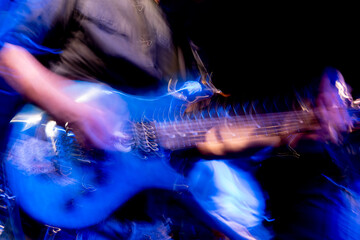 Guitarist playing solo in motion blur