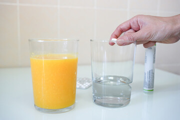 an orange juice and a capsule in water. cold and congestion immunity