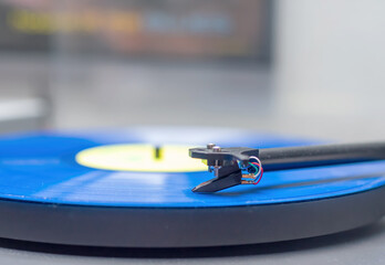 blue vinyl record playing on a record player