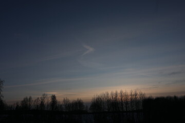 Fantastic winter landscape during sunset. colorful sky glowing by sunlight. Dramatic wintry scene