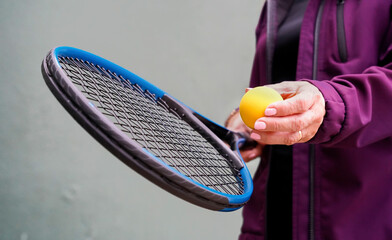 sportswoman woman with tennis ball and racket with copy space