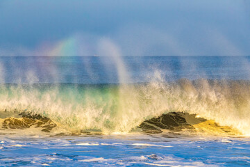 Extremely high huge waves with rainbow in Puerto Escondido Mexico.