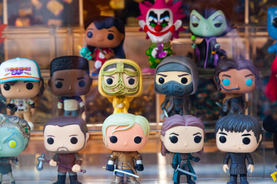 Motril, Spain - 09.24.2022: Collectible figurines of funko pop on a shop window, close-up.