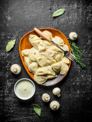Dumplings with mushrooms and sour cream.