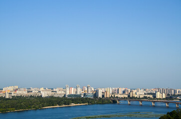 View from above of Paton Bridge and residential buildings of the left bank of Dnipro in Kyiv, Ukraine.