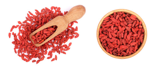 Dried goji berries in wooden scoop Isolated on white background