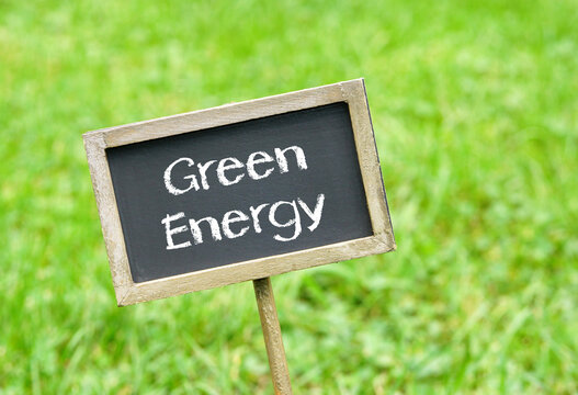 Green Energy, chalkboard with text on green grass background