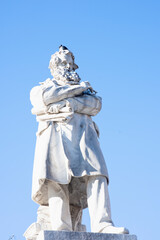 The statue of Niccolo Tommaseo famous literary writer against the blue sky in Venice, Italy