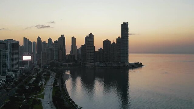 Balboa  Panama, Beautiful Big City Skyline Sunrise Or Sunset With Orange Sky Aerial Footage Panama City