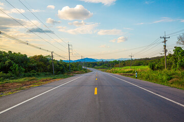 Rural road with beautiful mountains in Thailand,sky road over top of mountains with green jungle in Nan province, Thailand