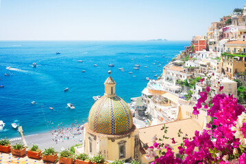 view of Positano - famous old italian resort at summer with flowers, Italy, toned image