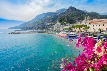 Amalfi town and summer beach with clean blue water and flowers , Italy