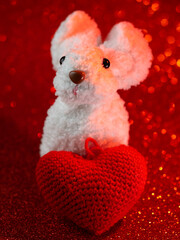 Valentine's Day greeting card with a bunny and a red heart .