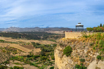 Fototapeta na wymiar Panoramic view of cliff with Ronda Viewpoint Kiosk in Ronda, Spain on October 23, 2022