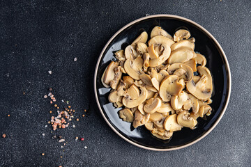champignons slices mushrooms ready to eat healthy meal food snack on the table copy space food background rustic top view keto or paleo diet veggie vegan or vegetarian food