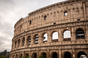 Fototapeta na wymiar Roman Colosseum from outside in cloudy day, in Rome, in Italy