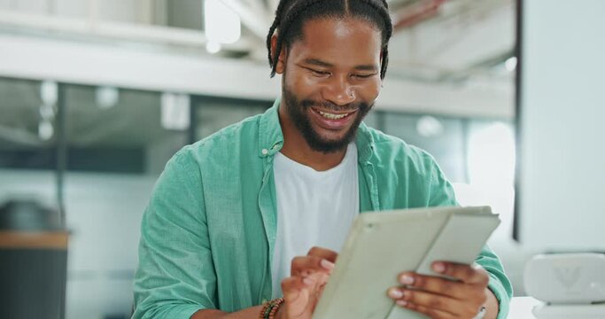 Tablet, business and black man typing in office, social media or research. Break, technology and happy male employee holding digital touchscreen for networking, internet browsing or web scrolling.