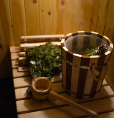 Sauna. internal space. birch broom and wooden bucket