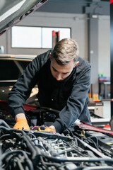 Fototapeta na wymiar Car mechanic working in a garage