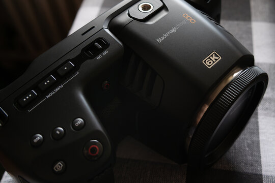 County Cork, Ireland, August 16, 2022. A movie camera Blackmagic Pocket Cinema Camera 6K (body) on a checkered tablecloth, a close-up shot. Illustrative editorial.