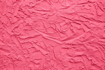 Abstract drawing on plastered wall. Toned Viva Magenta, background, texture. Copy space. Selective focus.
