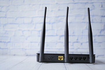 Wi-Fi router with cables on table 