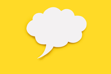 Speech bubble in the form of a cloud on a yellow background. Free space for text. Empty white...
