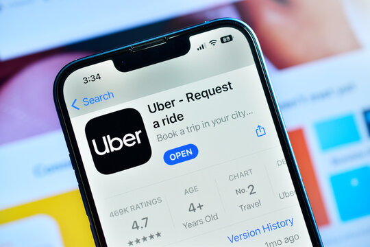 Uber app on smartphone, online taxi booking application