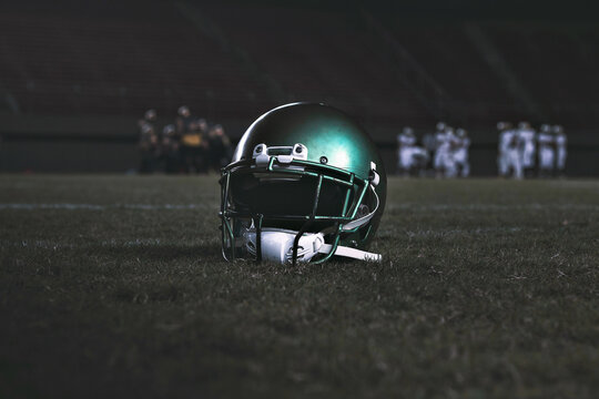 American football helmet on the grass