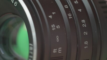 Cinema lens rotating rings to adjust exposure
