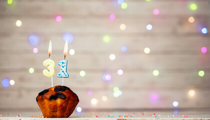 Happy birthday background with muffin and number of candles on light bulbs bokeh background....