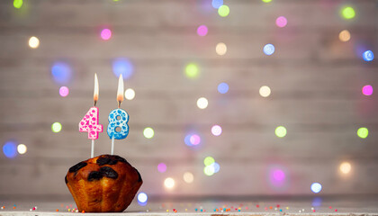 Happy birthday background with muffin and number of candles on light bulbs bokeh background. Greeting card happy birthday copy space with number  48