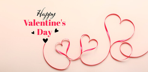 Banner for Valentine's Day with hearts made of ribbon on beige background