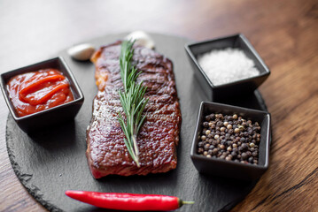 grilled beef steak on wooden background 
