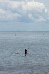 Fototapeta na wymiar fisherman on the beach of Barra in Salvador northeast of brazil