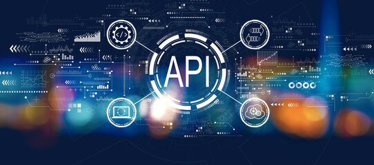 API - application programming interface concept with blurred city at night