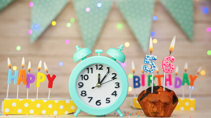 Happy birthday greeting card with muffin pie and retro clock on clock hands new birth. Beautiful...