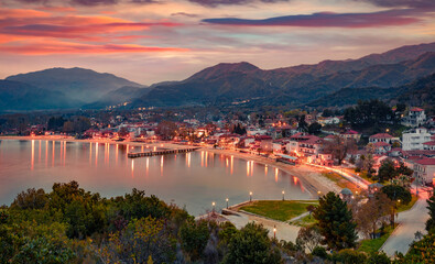 Astonishing spring sunrise on the shore of Aegean sea. Aerial morning cityscape of Olimpiada town,...