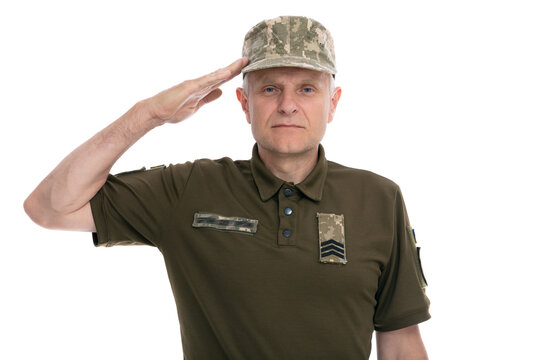 Ukraine army soldier isolated on white background. Portrait of old Ukrainian defender saluting against white background. Stand for Ukraine.