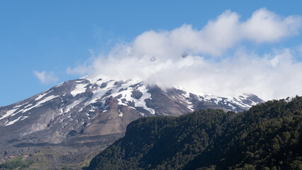 Active volcano with clouds on the mountain, southern Chile.