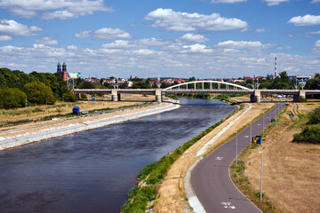 Fototapeta na wymiar Cityscape with a road bridge across the Warta river in the city of Poznan