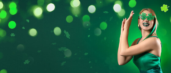 Beautiful young woman wearing party eyeglasses on green background with space for text. St....