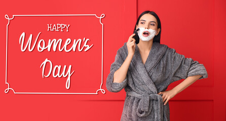Young woman with shaving foam on her face against red background. Greeting card for International...