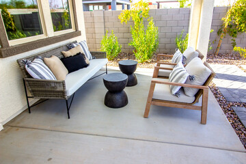 Back Yard Patio Area With Couch And Two Chairs