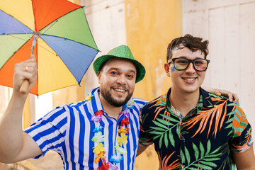 Brazilian Carnival. Happy gay couple having fun during the carnival block