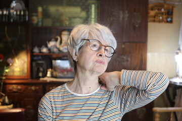 Senior woman suffering neck pain